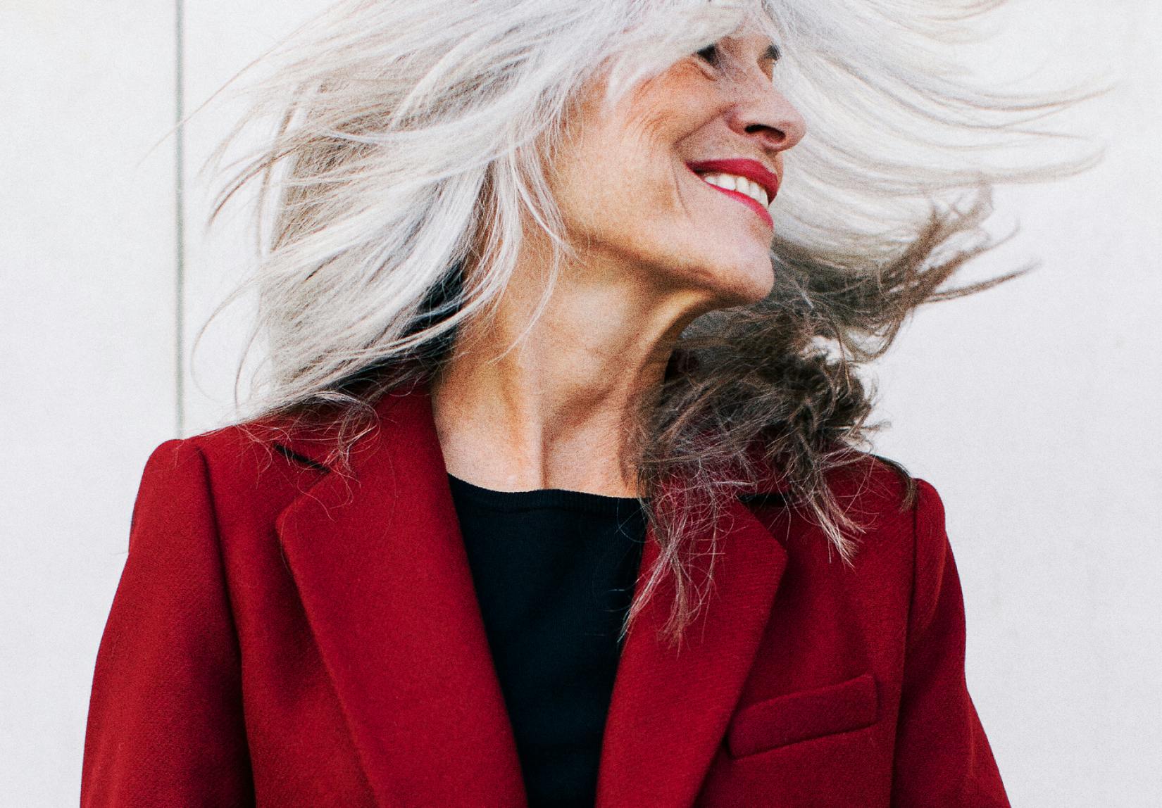 Portrait Of A Mature Woman With Grey Long Hair In Movement