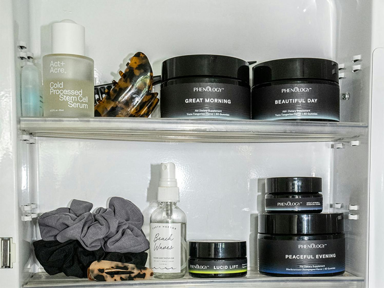 Medicine cabinet "shelfie" of beauty and wellness products for women, featuring Phenology produc